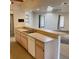 Kitchen featuring bar-top seating, a double sink, modern appliances, and ample counter space at 20408 Andover Ave, Port Charlotte, FL 33954