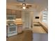Bright kitchen with ample counter space, modern appliances, and views into the dining and living areas at 20408 Andover Ave, Port Charlotte, FL 33954