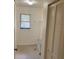 Functional laundry room featuring a utility sink, storage shelf, and closet at 20408 Andover Ave, Port Charlotte, FL 33954