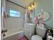 Bathroom featuring a shower-tub combo, modern fixtures, and a mirrored vanity at 21938 Catherine Ave, Port Charlotte, FL 33952