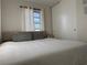 Bedroom featuring a large bed with gray pillows, a closet, and natural light at 21938 Catherine Ave, Port Charlotte, FL 33952