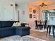 Living room with a cozy breakfast nook, adorned with wall decor and a modern chandelier at 21938 Catherine Ave, Port Charlotte, FL 33952