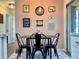 Inviting dining area with modern decor, adjacent to a kitchen featuring a breakfast bar at 21938 Catherine Ave, Port Charlotte, FL 33952