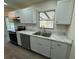 Modern kitchen featuring stainless steel appliances, white cabinets, and marble countertops at 21938 Catherine Ave, Port Charlotte, FL 33952