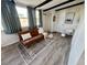 Inviting living room with a comfortable couch, large windows, and stylish decor at 21938 Catherine Ave, Port Charlotte, FL 33952