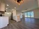 Bright and airy open-concept living room with hardwood floors and ample natural light at 21938 Catherine Ave, Port Charlotte, FL 33952