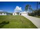 Charming single-story home with a well-manicured lawn and a two-car garage at 23254 Stelling Ave, Port Charlotte, FL 33980