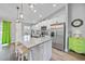 Well-equipped kitchen boasting stainless steel appliances, granite countertops, and an island with seating at 23254 Stelling Ave, Port Charlotte, FL 33980
