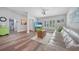 Inviting living space featuring wood floors, neutral decor, and a comfortable seating area at 23254 Stelling Ave, Port Charlotte, FL 33980