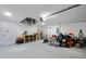 Spacious garage with ample storage space and overhead lighting at 2405 Vancouver Ln, North Port, FL 34286