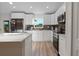 Modern kitchen featuring stainless steel appliances and custom cabinets at 2405 Vancouver Ln, North Port, FL 34286