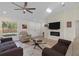 Spacious living room with a ceiling fan and large window at 2405 Vancouver Ln, North Port, FL 34286