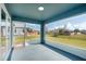 Screened porch with a view of the backyard and surrounding neighborhood at 2405 Vancouver Ln, North Port, FL 34286
