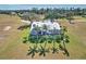 Beautiful aerial view of a home with a pool, screened lanai, and lush green lawn at 24344 Penhollow Ct, Punta Gorda, FL 33955