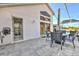 Beautiful outdoor living space with screened pool, patio table, and exterior shower access at 24344 Penhollow Ct, Punta Gorda, FL 33955