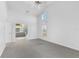 Bright bedroom with carpeted floors, access to ensuite bathroom with double vanities and shower at 24344 Penhollow Ct, Punta Gorda, FL 33955