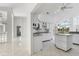 Spacious kitchen featuring white cabinets, sleek countertops, and modern appliances at 24344 Penhollow Ct, Punta Gorda, FL 33955