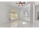 Inviting living room with lots of natural light, complemented by stylish light fixtures at 24344 Penhollow Ct, Punta Gorda, FL 33955