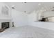 Spacious living room with tile flooring, a fireplace, and an open layout to the kitchen at 24344 Penhollow Ct, Punta Gorda, FL 33955