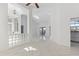 Expansive living space with high ceilings, sleek tile floors, and an open layout at 24344 Penhollow Ct, Punta Gorda, FL 33955