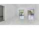 Bright and airy living space with tile floors, offering access to outdoor amenities at 24344 Penhollow Ct, Punta Gorda, FL 33955