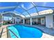 Exterior shot of the pool and lanai area, showcasing the seating and outdoor space at 24344 Penhollow Ct, Punta Gorda, FL 33955