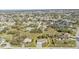 Expansive aerial view of a neighborhood featuring a home with a well-manicured lawn at 25202 Chiclayo Ave, Punta Gorda, FL 33983