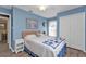 Light blue bedroom with neutral decor at 25202 Chiclayo Ave, Punta Gorda, FL 33983