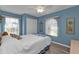 Blue bedroom with bright natural light at 25202 Chiclayo Ave, Punta Gorda, FL 33983
