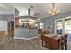 Dining area with access to the lanai and an adjacent galley kitchen at 25202 Chiclayo Ave, Punta Gorda, FL 33983