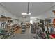 Spacious garage workshop featuring workbenches, storage, and ample room for projects at 25202 Chiclayo Ave, Punta Gorda, FL 33983