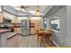 Bright kitchen with stainless steel appliances and a cozy dining nook at 25202 Chiclayo Ave, Punta Gorda, FL 33983