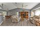 Open-concept living room and dining area with vaulted ceiling and updated flooring at 25202 Chiclayo Ave, Punta Gorda, FL 33983