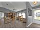 Spacious living room with a ceiling fan, lots of seating, and modern flooring at 25202 Chiclayo Ave, Punta Gorda, FL 33983