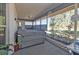 A covered, screened-in patio featuring a jacuzzi and a pleasant outdoor view at 25202 Chiclayo Ave, Punta Gorda, FL 33983