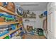 Well-lit storage room with ample shelving and storage for household items at 25202 Chiclayo Ave, Punta Gorda, FL 33983