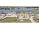 Aerial view of condos with lake view and parking lot at 26300 Rampart Blvd # 404, Punta Gorda, FL 33983