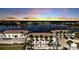 Beautiful aerial view of condos with lake view at sunset at 26300 Rampart Blvd # 404, Punta Gorda, FL 33983