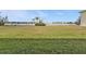 Beautiful backyard view facing the lake and palm trees, perfect for relaxation at 26300 Rampart Blvd # 404, Punta Gorda, FL 33983