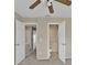 Hallway with open bathroom and closet doors at 26300 Rampart Blvd # 404, Punta Gorda, FL 33983