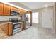 Bright kitchen with stainless steel appliances and ample cabinet space at 26300 Rampart Blvd # 404, Punta Gorda, FL 33983