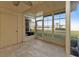 Screened-in lanai with tile floor and lake view at 26300 Rampart Blvd # 404, Punta Gorda, FL 33983