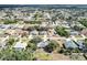 Expansive aerial view of a residential neighborhood showcasing single-Gathering homes and lush greenery at 2822 Logsdon St, North Port, FL 34287