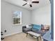 Comfortable bedroom with a ceiling fan, a window with blinds, and neutral walls at 2822 Logsdon St, North Port, FL 34287