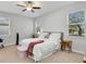 Bedroom with ceiling fan and natural light at 2822 Logsdon St, North Port, FL 34287