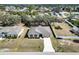 Inviting home exterior with well-manicured front yard, showcasing a neatly paved driveway leading to the garage at 2822 Logsdon St, North Port, FL 34287