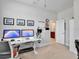 Bright office featuring dual monitors, an ergonomic chair, and a view to the bathroom at 2822 Logsdon St, North Port, FL 34287