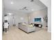 Bright living room with neutral colors, tile floors, ceiling fan, and a comfortable gray sofa at 2822 Logsdon St, North Port, FL 34287