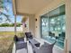Covered patio featuring outdoor seating, offering a perfect spot to unwind and enjoy outdoor living at 2822 Logsdon St, North Port, FL 34287