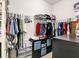 Spacious walk-in closet with built-in shelving and hanging racks, perfect for organization at 2822 Logsdon St, North Port, FL 34287